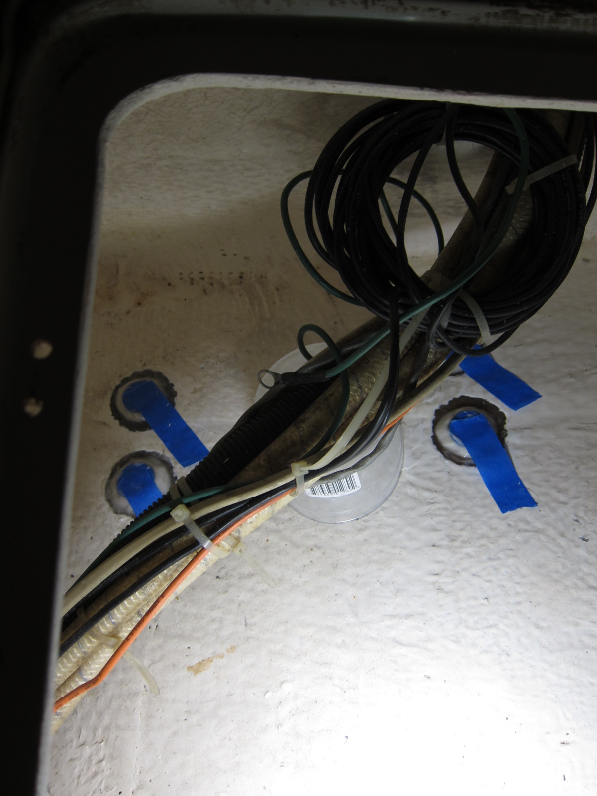 G10/FR4 discs epoxied over the screw holes inside the hull.