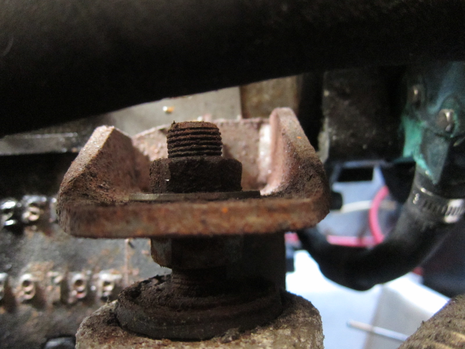 Old rusted motor mounts need replacing.