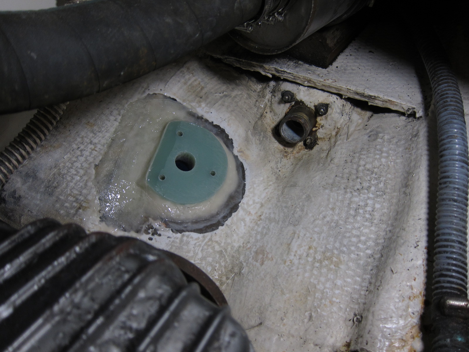 Fiberglass placed over drainage channel.