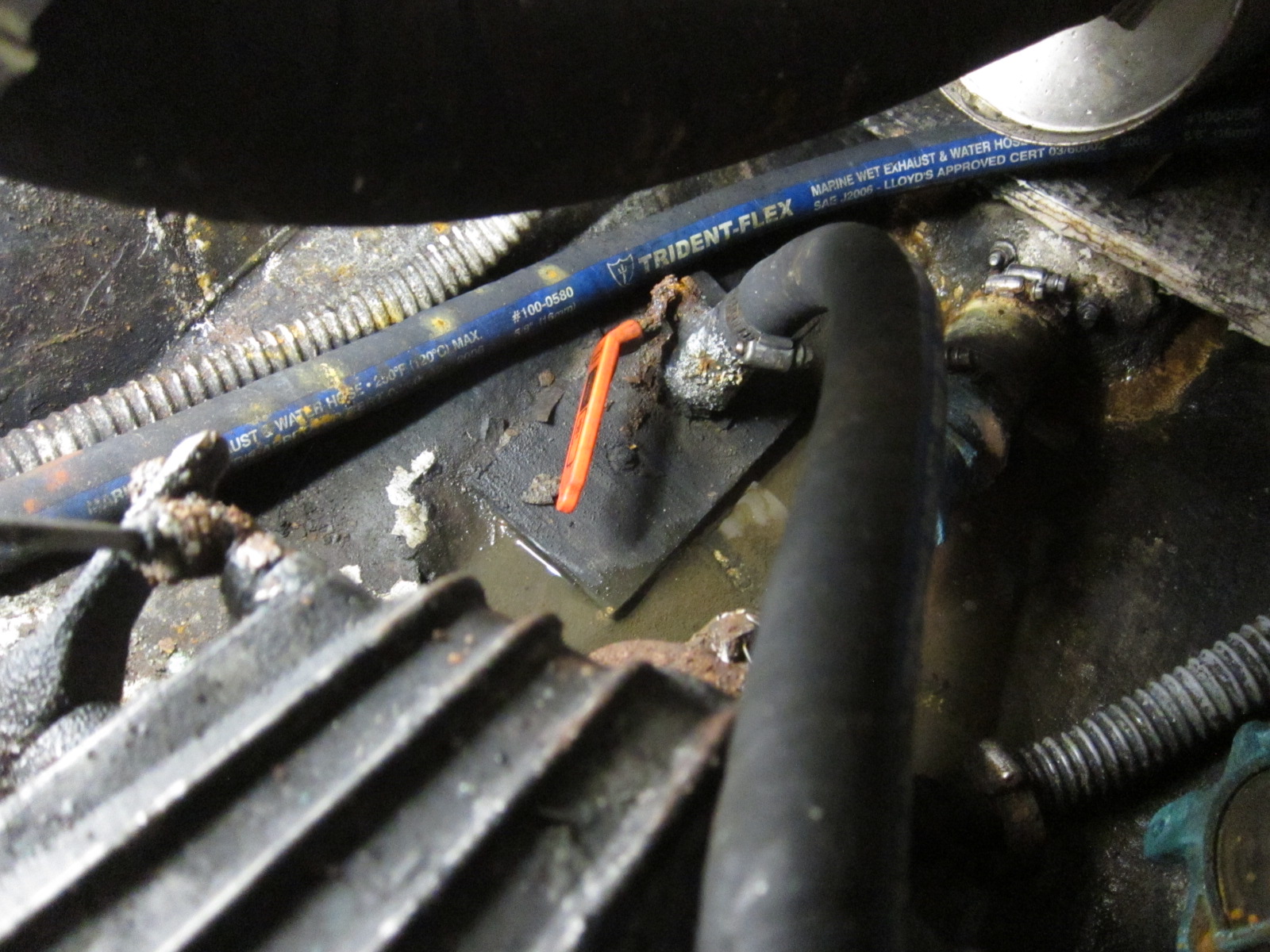 Raw water intake thru-hull before. The red valve handle is broken.