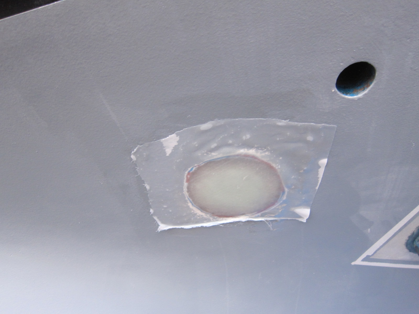 All fiberglassed over. The hole is gone.